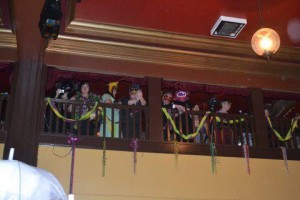 Tossing beads from the balcony at the Bossanova Ballroom